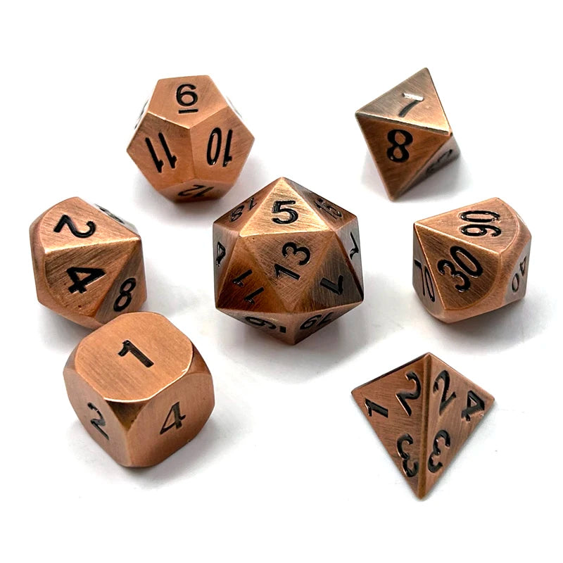 A set of premium metal polyhedral dice with a multicolor gold finish, showing various numbered dice.
