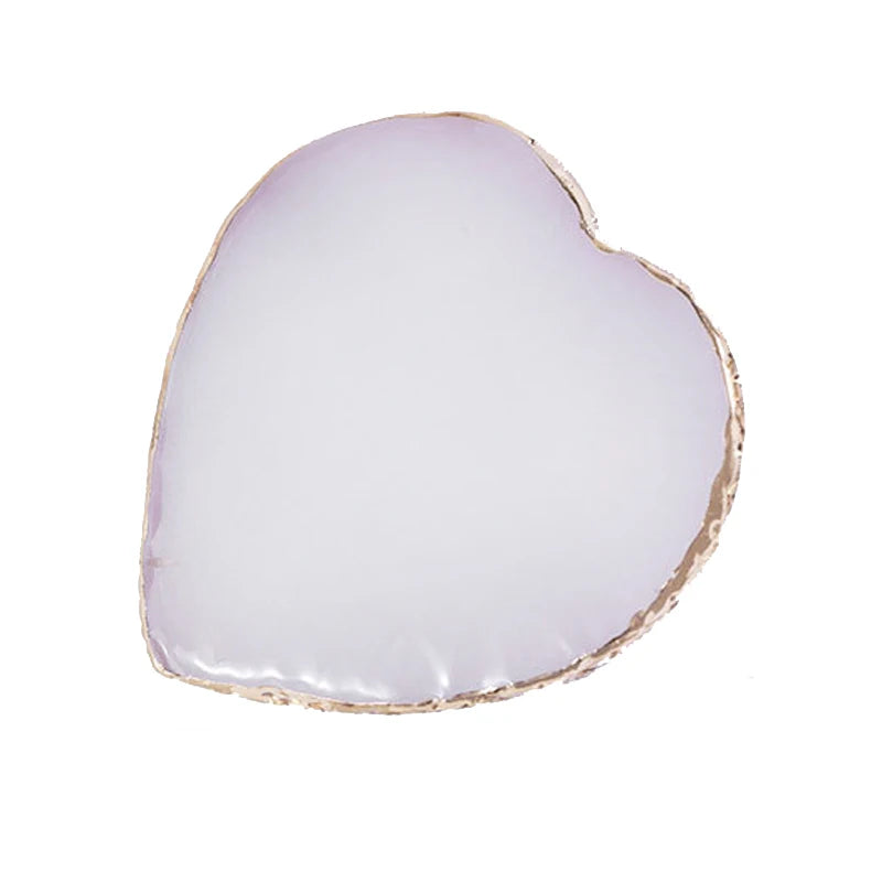 A heart-shaped luxury resin nail art palette with a soft pink color and gold trim.