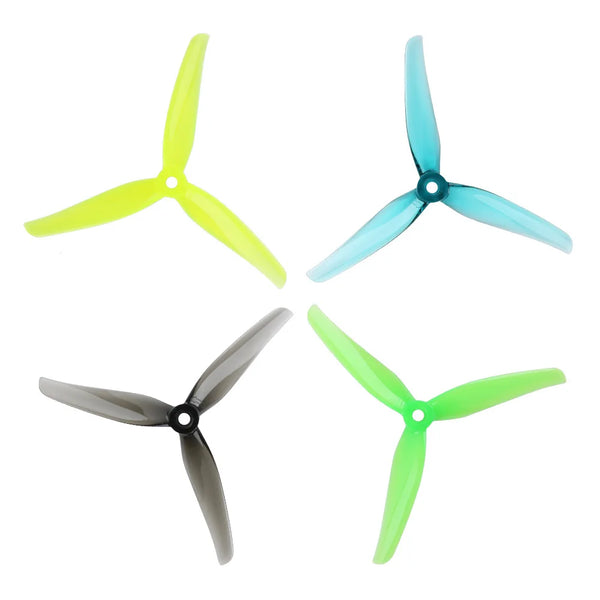 Three high-efficiency drone propellers in yellow, blue, and green colors shown from above.