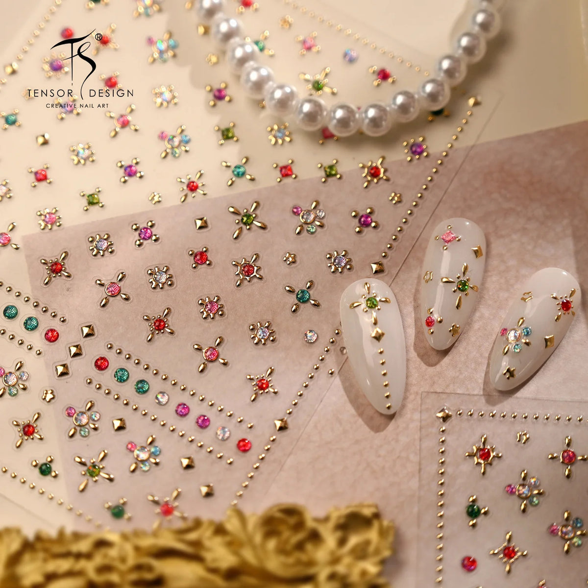 Close-up of sparkling 5D diamond nail art stickers and pearl beads arranged on a translucent paper background.