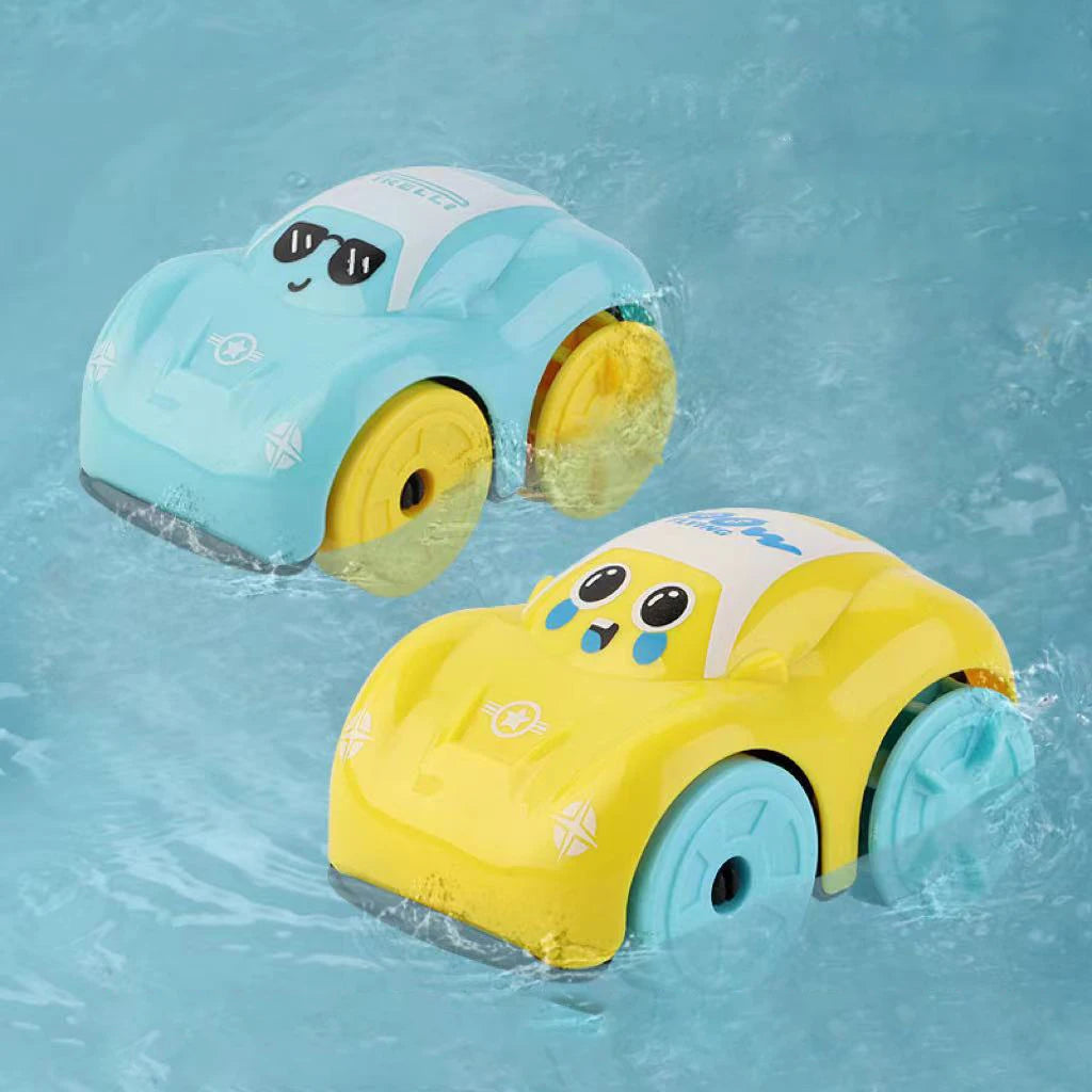 A yellow bath toy car with wheels is floating in blue water.