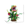 A green and pink floral skull building block set featuring a large plant structure.