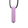 A pink silicone chew necklace with a tapered, elongated shape and a black cord.