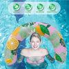 A young woman is lying on a pink and green U-shaped inflatable swim ring in blue water.