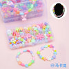 A clear plastic box filled with colorful polymer clay beads and a separate ring of similar beads.