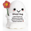 Handmade white crochet ghost doll with a pink flower and an emotional support card