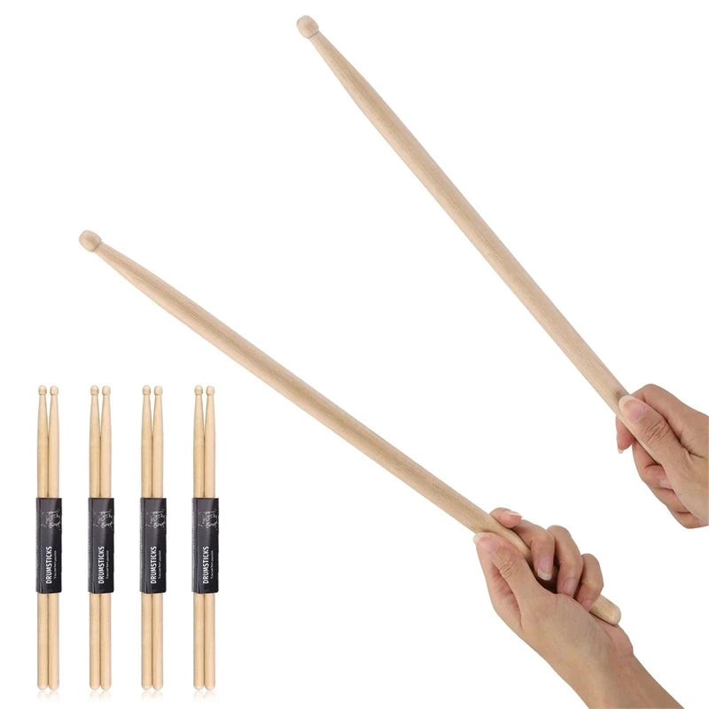 A pair of light wood maple drumsticks are shown being held, with several individual sticks displayed below.