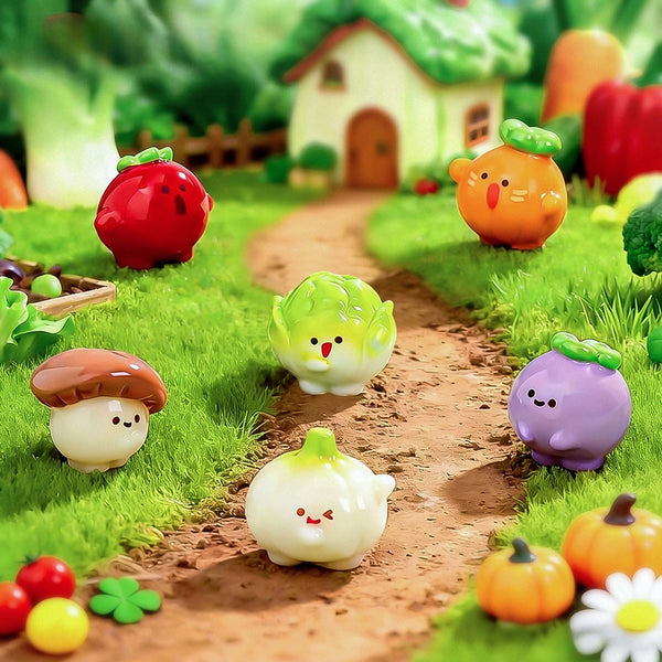 A collection of colorful cartoon vegetable resin figurines, including tomatoes, squash, and mushrooms, arranged on a grassy p