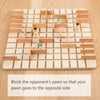 A wooden strategy chess game board with pieces showing a pawn blocking an opponent's pawn.