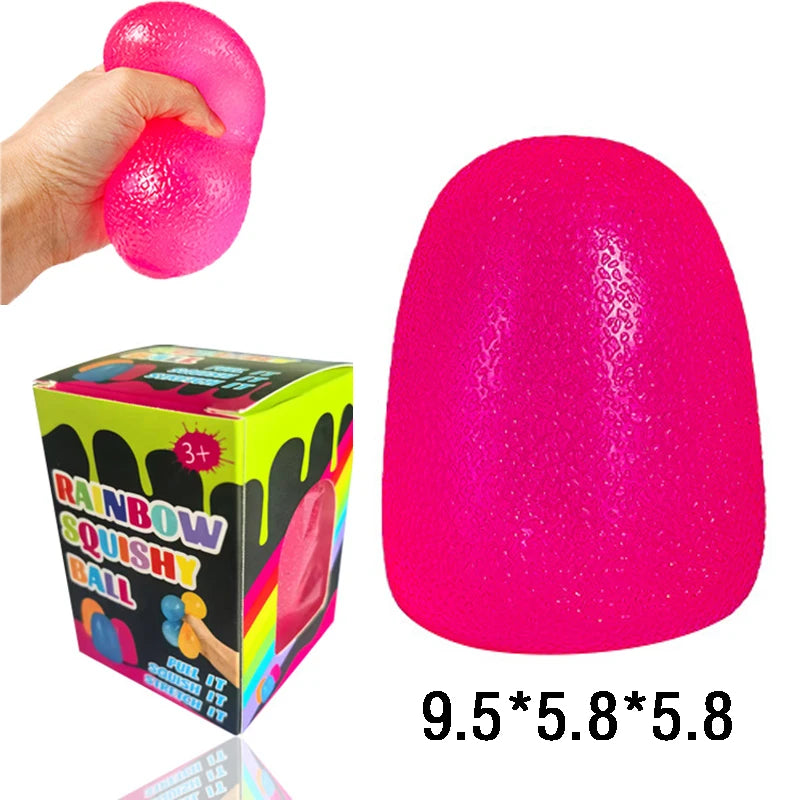 A bright pink squishy ball is shown being squeezed by a hand, next to its packaging and dimensions.
