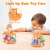 A child is playing with a light-up gear toy car, demonstrating the light button feature.