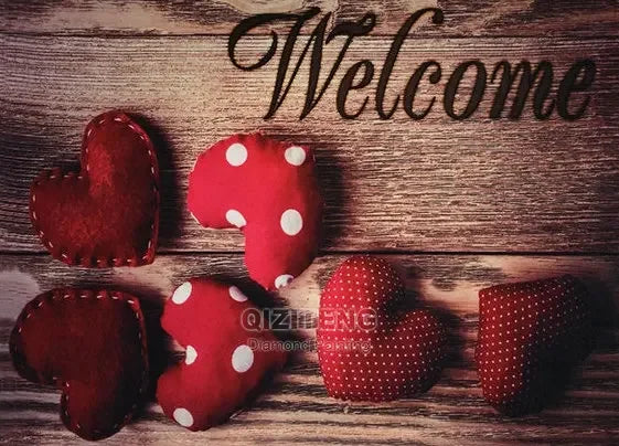 A collection of red felt hearts with white polka dots arranged on a wooden surface.