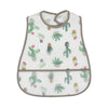 A white baby bib with a green cactus pattern and a brown trim.