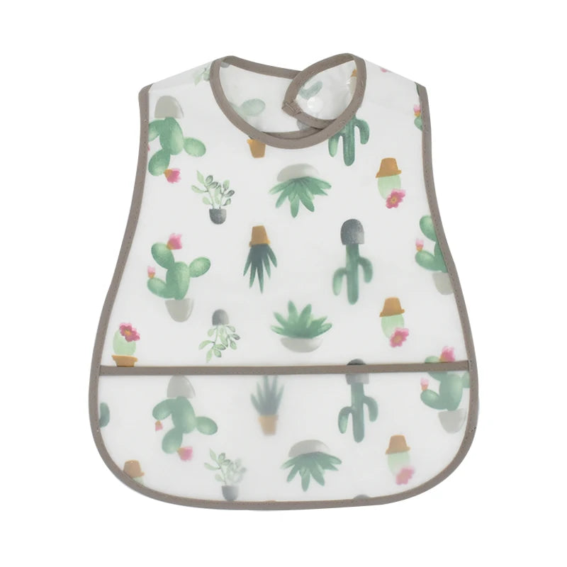 A white baby bib with a green cactus pattern and a brown trim.