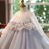 A white and gray tulle princess dress displayed on a mannequin.