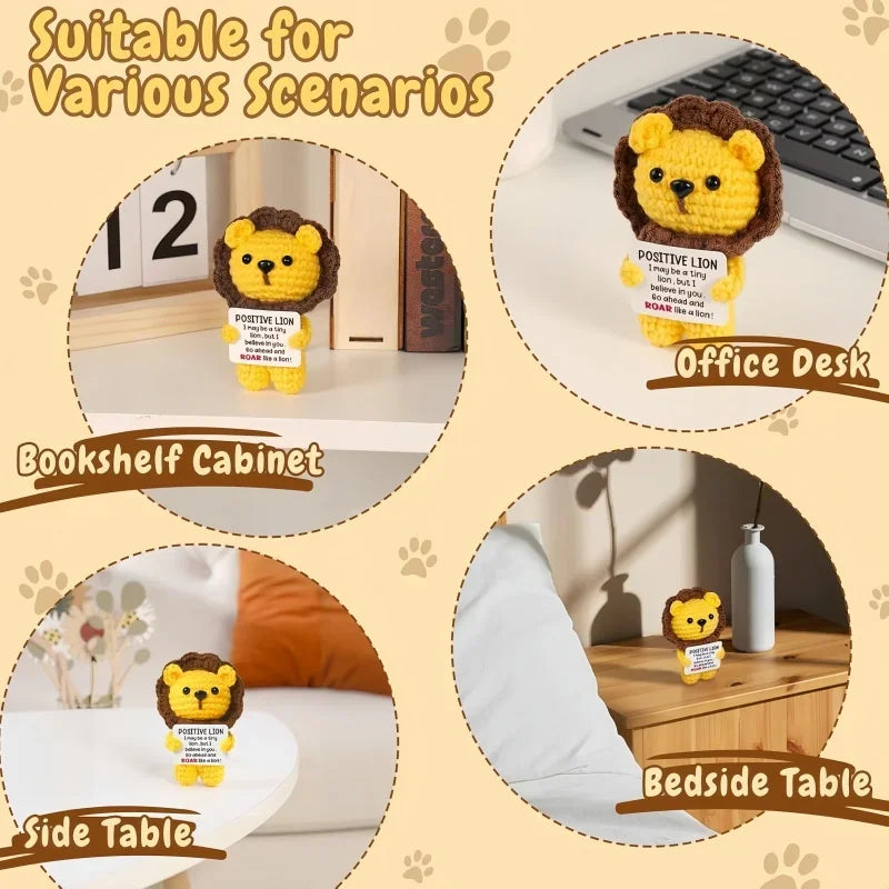 A yellow crochet lion doll with a positive message card displayed on an office desk, bookshelf cabinet, and bedside table.