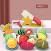 A set of colorful pretend play kitchen items including fruits and vegetables for children