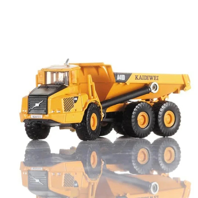 A yellow 1:87 scale articulated dumper truck diecast model.