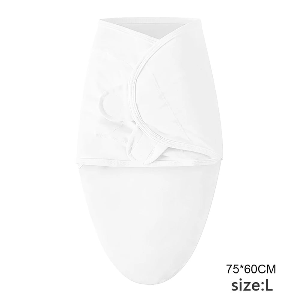 White cotton newborn swaddle blanket and hat set folded neatly