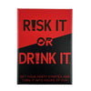 A red and black box for the Risk It or Drink It party card game.