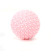 Pink 3D printed sensory fidget roller keychain with a textured, diamond-patterned surface.