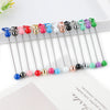 A collection of metal keychain bars with lobster clasps in various colors and finishes arranged in a line.