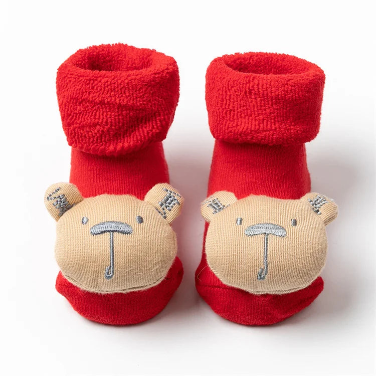 Pair of red baby anti-slip cotton socks with festive Christmas bear designs