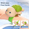 A soft silicone turtle-shaped wrist wear for free hands, shown being worn on a wrist.