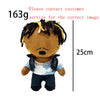 A plush doll resembling Eminem, XXXTentacion, and Frank Ocean with dreadlocks and a light blue shirt.