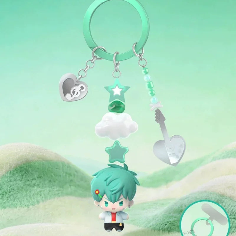 A mystery blind box figure of a character with green hair and white clothing is displayed below a silver heart-shaped charm o