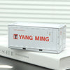 A white miniature industrial iron storage box with an openable lid resting on a white book.