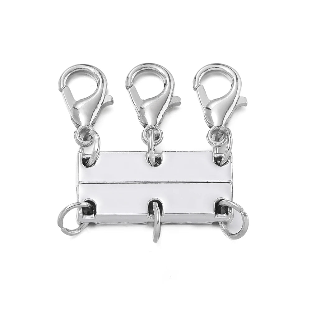 Silver magnetic layering clasps for necklaces and bracelets displayed on a white background.