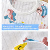 Close-up of a white cotton pajama top featuring a colorful fish design and embroidered details.
