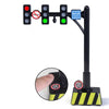 A black wooden train track accessory set featuring airport and gas station scenes with illuminated lights.