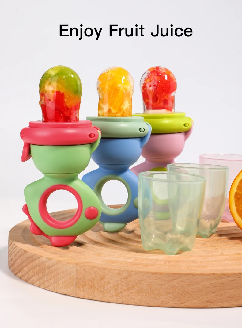 Colorful dinosaur-shaped silicone fruit and veggie feeder with various fruit pieces