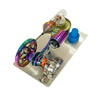A miniature Stirling engine model featuring a purple and green mechanism connected to a light bulb.