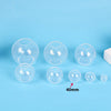 A set of clear silicone sphere molds used for resin crafting, shown against a light blue background.