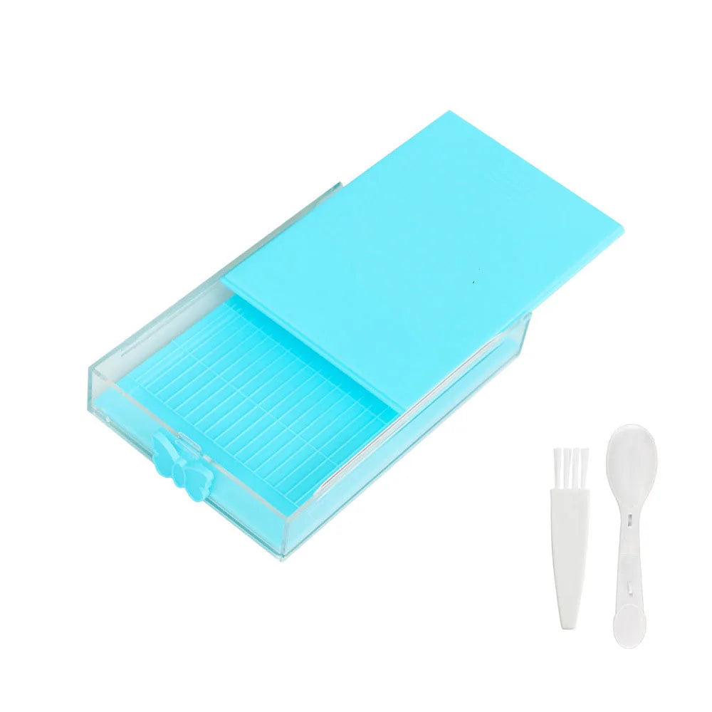 A light blue diamond painting storage organizer box with a clear tray and included tools.