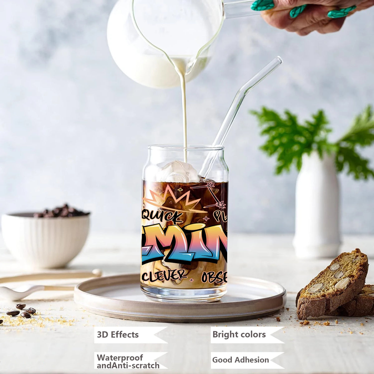 A glass of liquid being poured into a glass jar featuring zodiac sign graffiti art stickers.