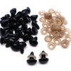 Une collection de nez en plastique de sécurité noir et beige pour les poupées amigurumi.