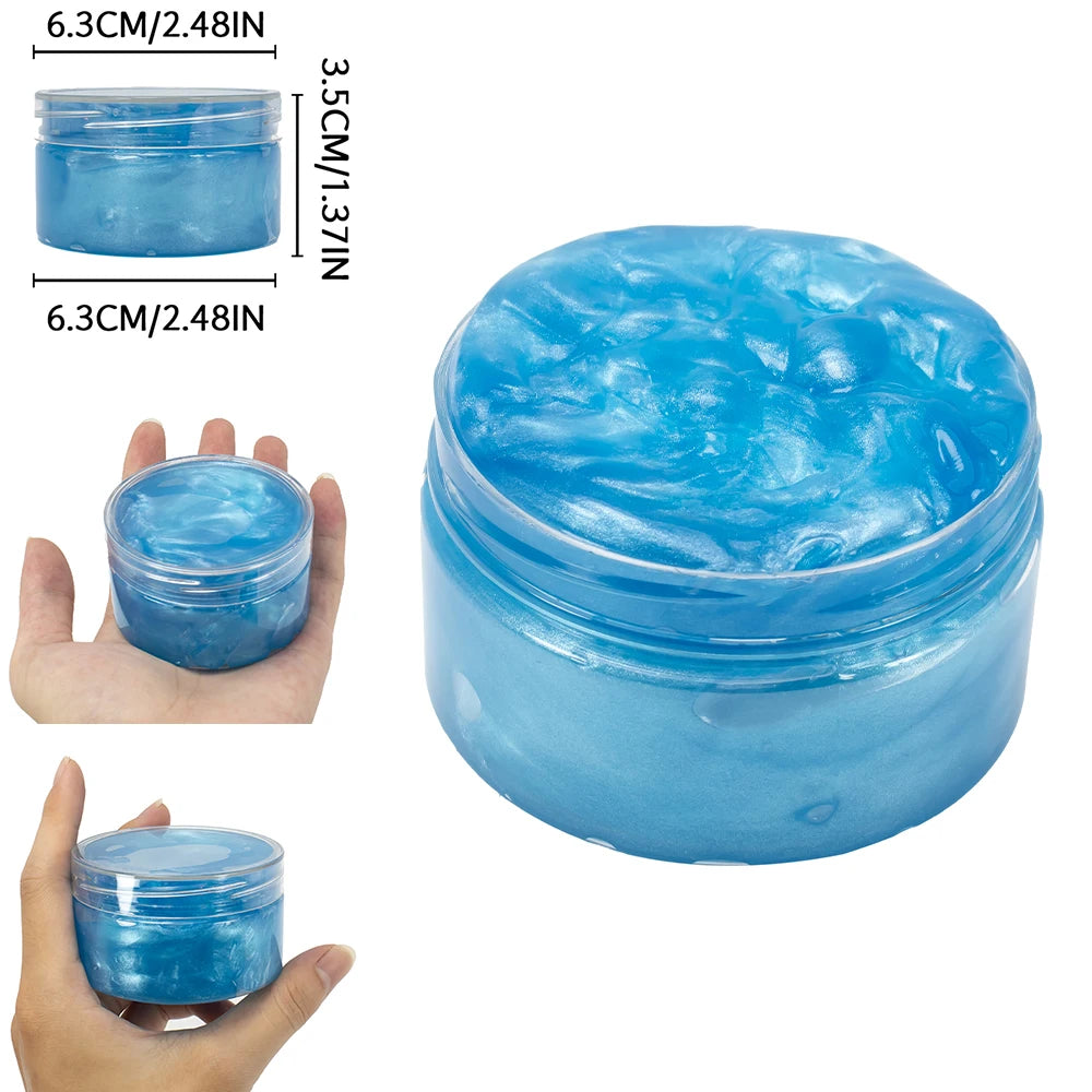 A clear jar of blue glitter slime putty with a lid shown next to a hand for scale.