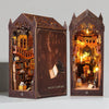 A detailed wooden DIY book nook kit featuring miniature furniture and a magic library scene.