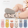 A collection of cute cartoon animal non-slip socks for babies and toddlers in various colors and patterns.