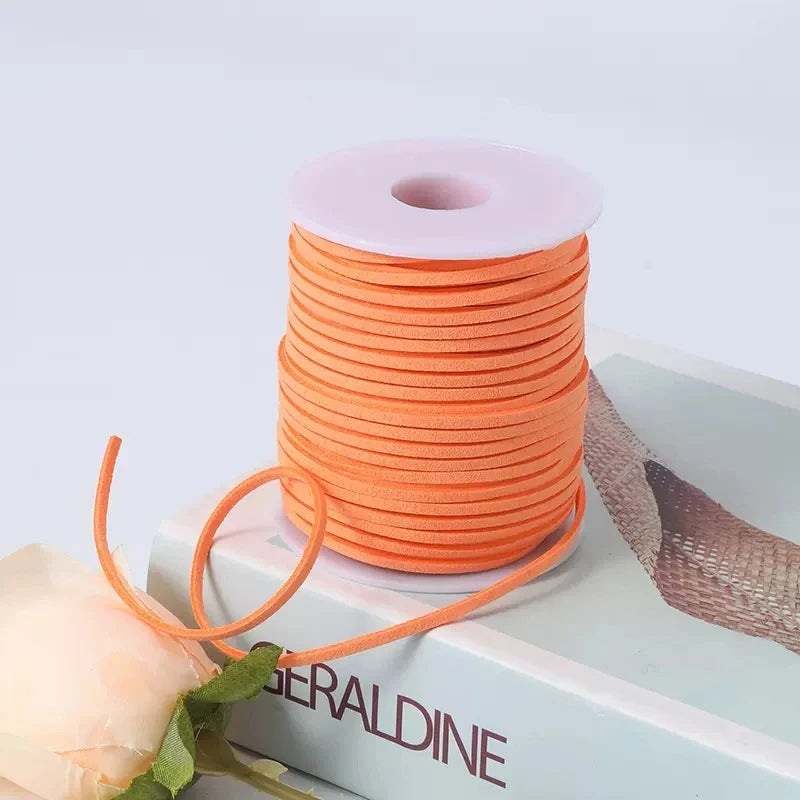 A roll of orange velvet faux suede braided ribbon for crafting and gift wrapping