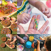 Kids making glow-in-the-dark loom band bracelets using beads and string in a creative activity.