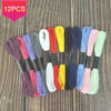 A collection of 12 packs of vibrant colored embroidery floss for cross stitch and crafts