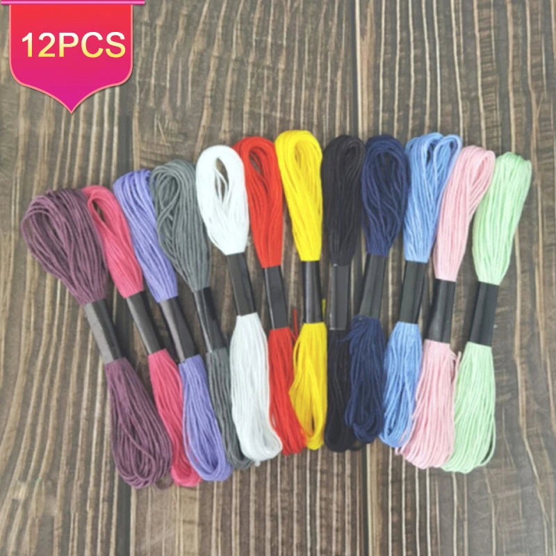 A collection of 12 packs of vibrant colored embroidery floss for cross stitch and crafts
