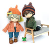 A 1/12 scale doll featuring a boy with gray hair wearing an orange denim jacket and a striped knit hat.