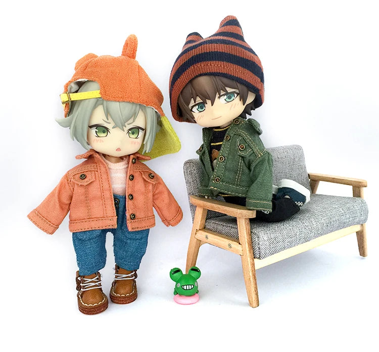 A 1/12 scale doll featuring a boy with gray hair wearing an orange denim jacket and a striped knit hat.