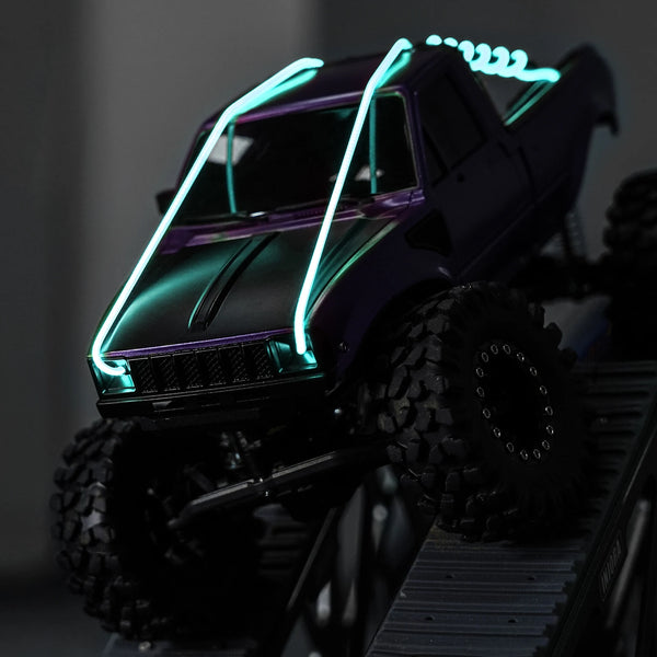 A purple RC car with bright cyan LED strip lights on the front grille and body.